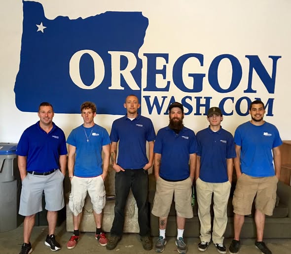 At the shop in Tigard, in front of the OREGON WASH.COM mural.