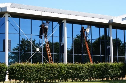Oregon Wash crew cleaning a multi-story commercial glass-front building
