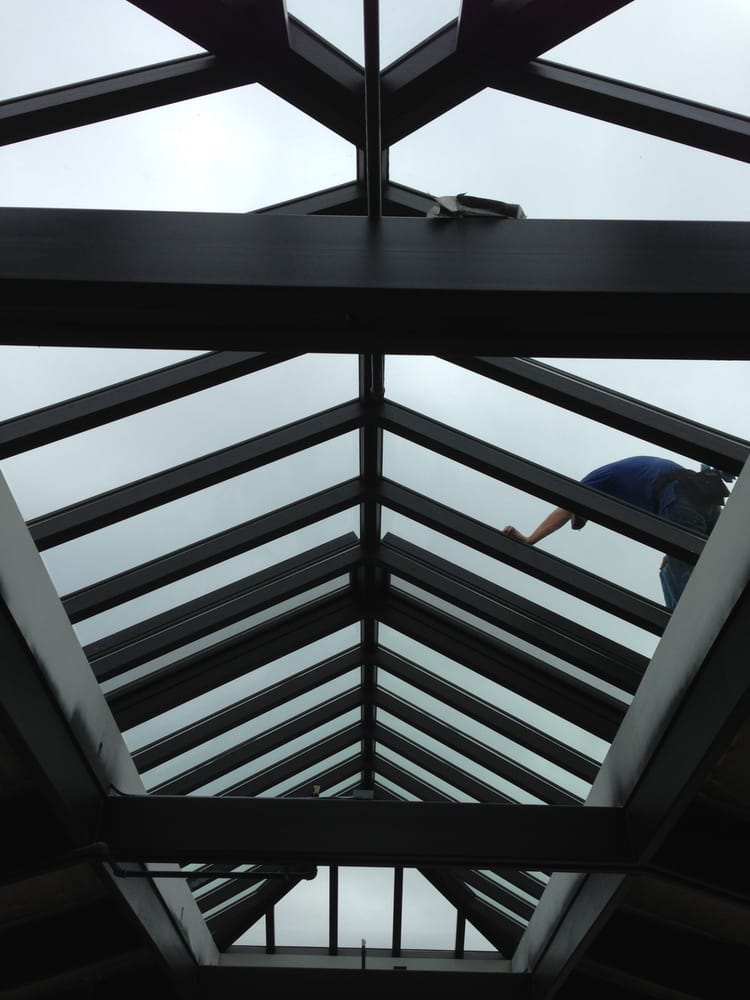 Skylight interior view — cleaning the underside from below.