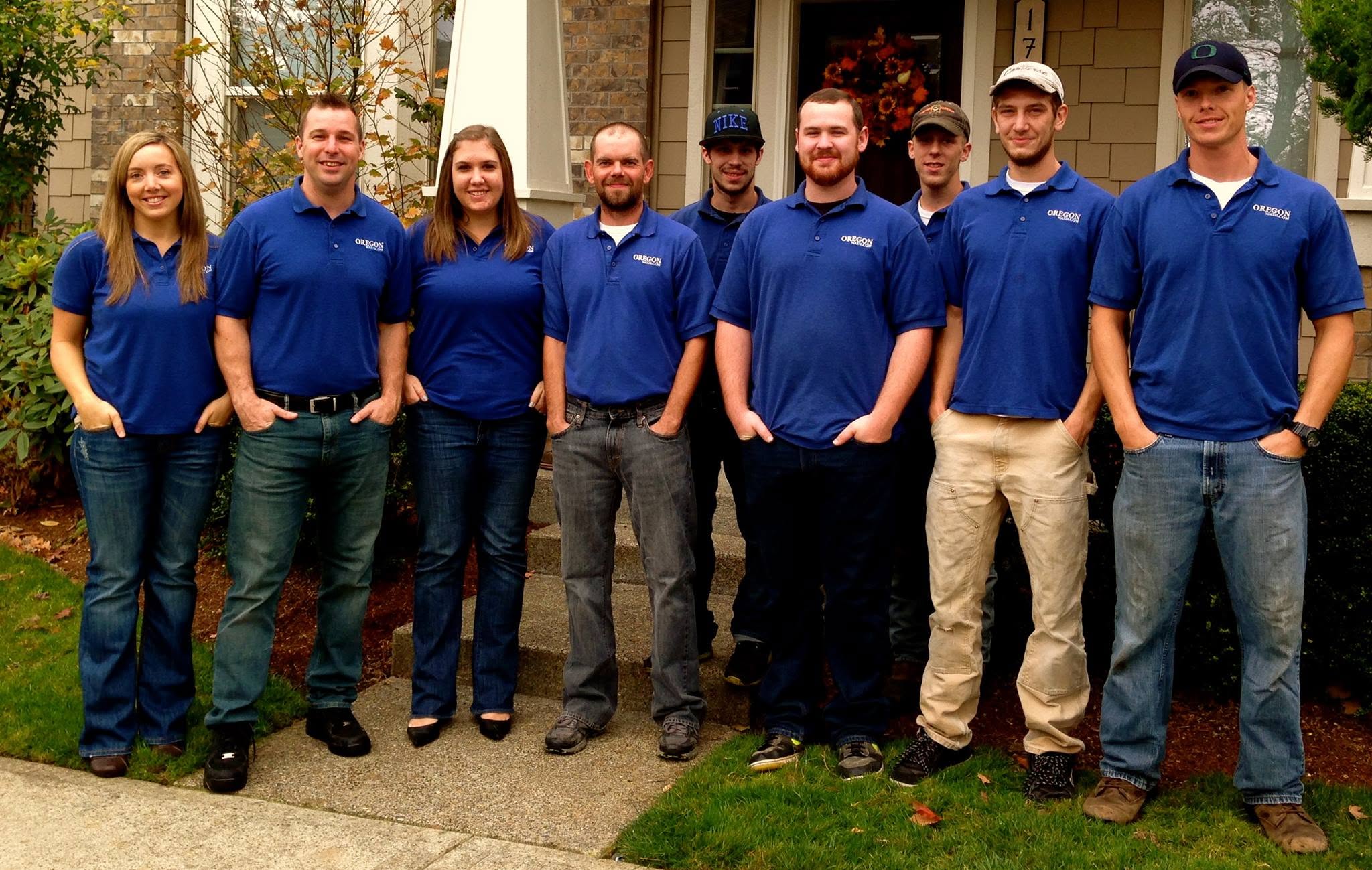 The Oregon Wash team — nine crew in Oregon Wash blue polos
